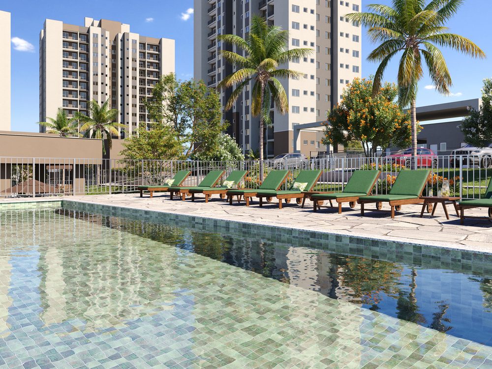 Piscina com deck e espreguiçadeiras, com as torres ao fundo
